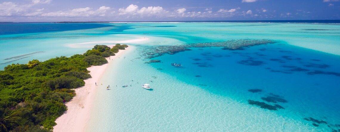 Aerial view of Maldives with turquoise waters and beaches.