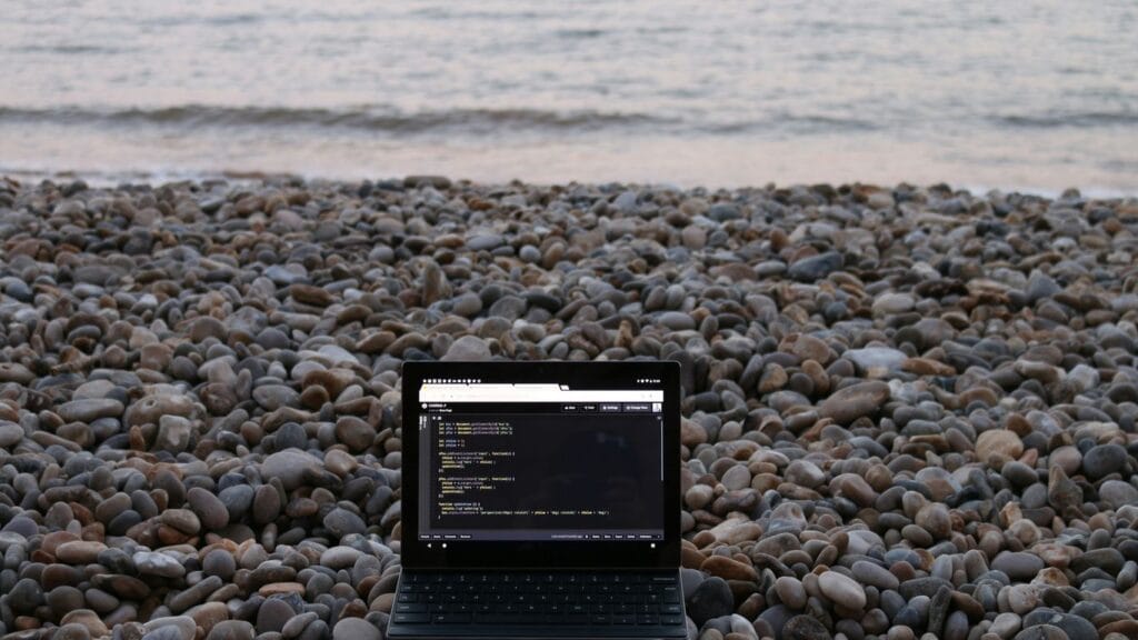 a tablet on a rocky beach